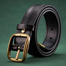 Black leather belt with a gold buckle on a green background, Obroi