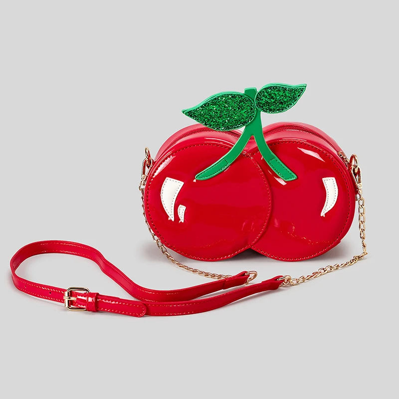 Obroi Red cherry-shaped handbag with a green leaf on a light gray background