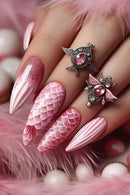 Pink and white nail art with decorative elements on a hand, Obroi