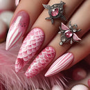 Pink and white nail art with decorative elements on a hand, Obroi