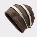 Brown knit beanie with a white stripe on a light gray background, Obroi