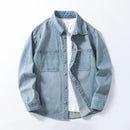 Obroi Light blue denim shirt on a white background