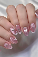 Close-up of a hand with pink nail art on a neutral background, Obroi