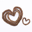 Heart-shaped wreath made of intertwined branches on a white background, Obroi
