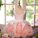 White dress with pink floral skirt on a mannequin in front of a window, Obroi