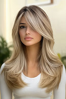 Woman with long, styled blonde hair wearing a white top, Obroi
