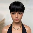 Woman wearing a gold chain necklace against a neutral background, Obroi