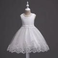 White lace dress on a mannequin against a dark background, Obroi