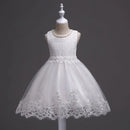 White lace dress on a mannequin against a dark background, Obroi