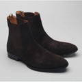 Pair of dark brown suede boots on a light gray background, Obroi