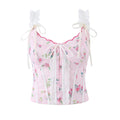 Pink floral corset top with lace details on a white background, Obroi
