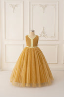 Yellow lace dress on a mannequin against a white wall, Obroi