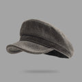 Gray flat cap on a gray background, Obroi