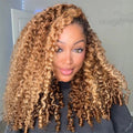 Woman with curly blonde hair wearing a dark gray top indoors, Obroi