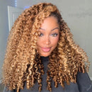 Woman with curly blonde hair wearing a dark gray top indoors, Obroi