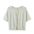 Light green cardigan with lace trim on a white background, Obroi