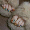Close-up of feet with colorful nail art on a fluffy surface, Obroi