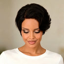 Woman with styled black hair against a neutral background, Obroi