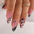 Nails with pink, black, and gold design on a neutral background, Obroi