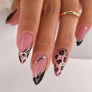 Nails with pink, black, and gold design on a neutral background, Obroi