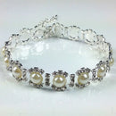 Pearl bracelet with silver accents on a white background, Obroi