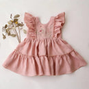 Pink children's dress with floral embroidery on a white background, Obroi