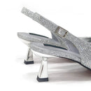 Silver glittery high-heeled shoes on a white background, Obroi