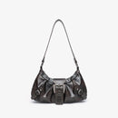 Black handbag with a buckle on a light gray background, Obroi