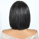 Back view of a person wearing a black bob wig with ' Obroi' branding.