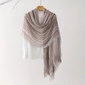 Striped scarf draped over a white shirt on a hanger against a white background, Obroi