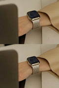 A silver metal mesh band smartwatch shown worn on a person's wrist, with a tan blazer in the background. The image is split into two horizontal panels showing the watch from slightly different angles, Obroi