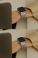 A silver metal mesh band smartwatch shown worn on a person's wrist, with a tan blazer in the background. The image is split into two horizontal panels showing the watch from slightly different angles, Obroi