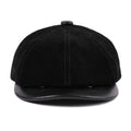 Black leather cap on a white background, Obroi