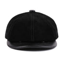 Black leather cap on a white background, Obroi