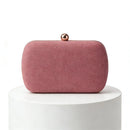 Pink clutch bag with a gold clasp on a white pedestal, Obroi