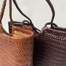 Close-up of woven handbags with braided handles on a light background, Obroi