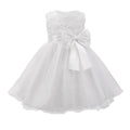 White flower girl dress with a large bow on a white background, Obroi
