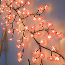 Decorative string lights shaped like cherry blossom branches on a plain background, Obroi