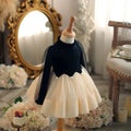 Mannequin wearing a black top and white skirt with tulle , Obroi