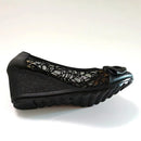 Black wedge shoe with lace detailing on a white background, Obroi