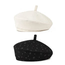 White and black berets with star pattern on a white background, Obroi