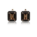 Pair of earrings with smoky brown gemstones on a white background, branded 'Obroi'.