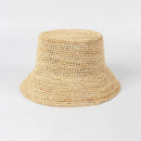 Beige woven bucket hat on a light gray background, Obroi