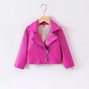 A bright pink faux leather moto jacket with an asymmetrical zipper, displayed on a wooden hanger against a plain white background, Obroi