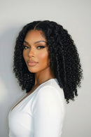Woman with styled hair against a plain background, Obroi