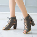 Gray lace-up high-heeled shoes on a light background, Obroi