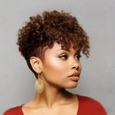 Woman with styled hair wearing gold earrings against a neutral background, Obroi