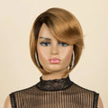A Obroi 100% human hair wig with a short, layered bob cut and side-swept bangs, displayed on a mannequin head against a solid beige background, Obroi
