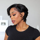 Woman with a stylish haircut wearing a black top against a neutral background, Obroi