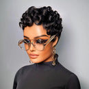 Woman with styled hair wearing glasses and a black top against a gray background, Obroi